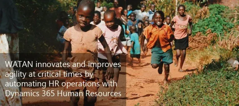 Children running along a dirt path in an African village, reflecting WATAN's community work