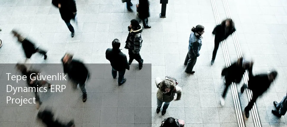 Motion-blurred overhead view of people walking through a busy public hall