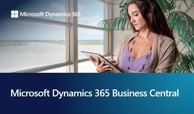 Pencere kenarında duran bir kadın elindeki tabletle Microsoft Dynamics 365 Business Central üzerinde çalışıyor